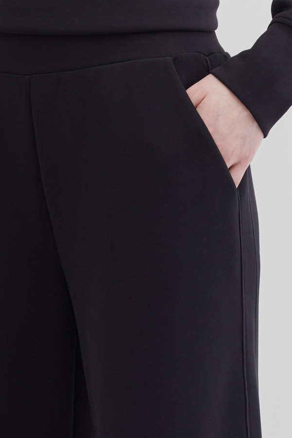 Брюки-клеш от колена